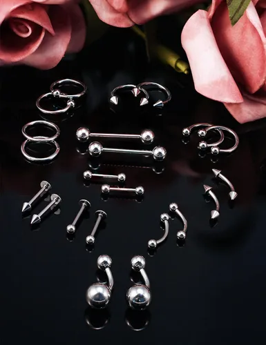 Vista 4 de Qiwnswoy - Juego de 36 piercings de acero quirúrgico 14G 16G para ombligo, lengua, pezón, nariz, tabique, piercing para tragus, joyería para mujeres