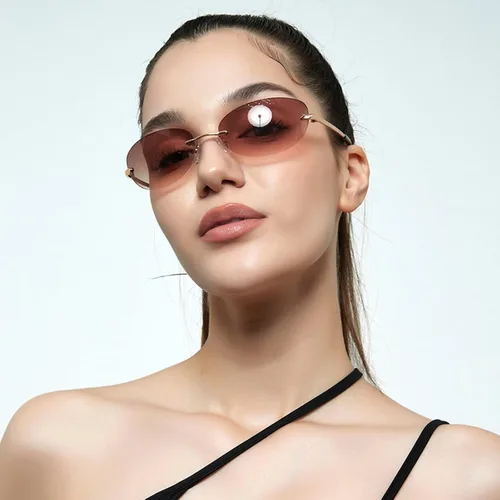 Vista 2 de KFPH Gafas de sol ovaladas pequeñas sin montura Y2K a la moda vintage de los años 90, gafas de sol con marco para mujeres y hombres futuristas