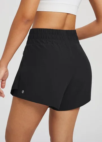 Vista 2 de BALEAF Pantalones cortos deportivos de cintura alta para mujer, falda de entrenamiento con volantes, pantalones cortos para correr, bolsillos