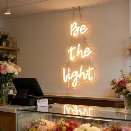 Vista 3 de Letrero de neón con texto en inglés "Be The Light", luces de neón decorativas con citas positivas para decoración de pared de habitación del hogar