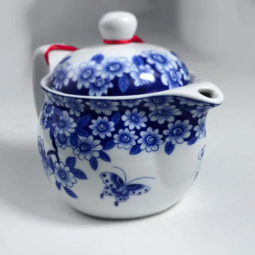 Vista 2 de Tetera 11.8 fl oz Azul y Blanco Flor Porcelana Tetera con Infusor Classic Water Pot (Flores mariposa)