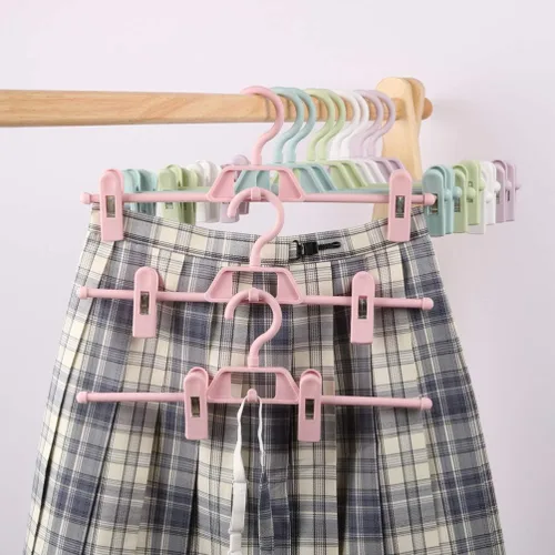 Vista 7 de DOITOOL Paquete de 10 perchas antideslizantes rosas para pantalones con clips ajustables, clips de plástico retráctiles para el hogar