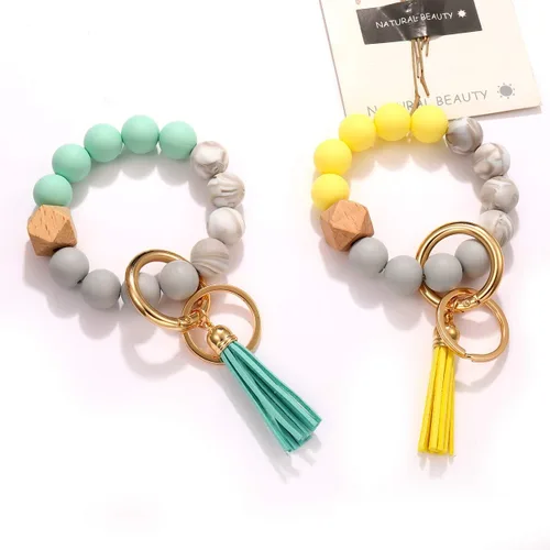 Vista 4 de 4 llaveros de silicona para mujer, pulsera elástica, llavero para casa y automóvil
