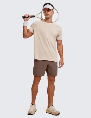 Vista 4 de CRZ YOGA Pantalones cortos de entrenamiento elásticos en cuatro direcciones para hombre, 7 pulgadas, suaves, duraderos, casuales, con bolsillos