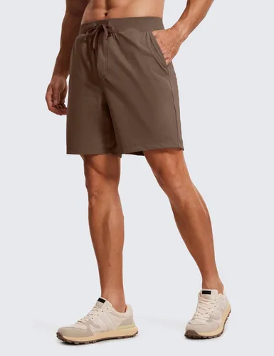 Vista 2 de CRZ YOGA Pantalones cortos de entrenamiento elásticos en cuatro direcciones para hombre, 7 pulgadas, suaves, duraderos, casuales, con bolsillos