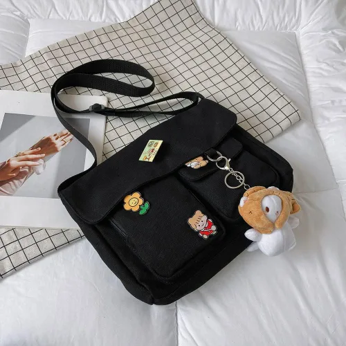 Vista 3 de Bolso cruzado de lona con alfileres Kawaii y colgante para mujeres y niñas bolso de mensajero casual para estudiantes mochila escolar