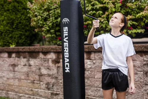 Vista 12 de Silverback Aro de baloncesto de altura ajustable en el suelo con tablero de vidrio templado, borde de separación profesional y almohadilla de tablero