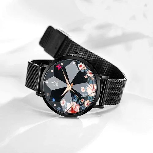 Vista 2 de SK Shengke - Reloj ultra delgado de creativo diseño minimalista floral o de cielo estrellado con extensibles de piel genuina o acero