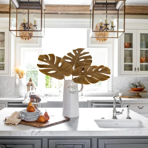 Vista 3 de DILATATA Hojas Artificiales de Monstera con Tallos de 28", Hojas Tropicales de Imitación Otoñales Falsas de Seda Naranja Monstera, Ramas de Palma
