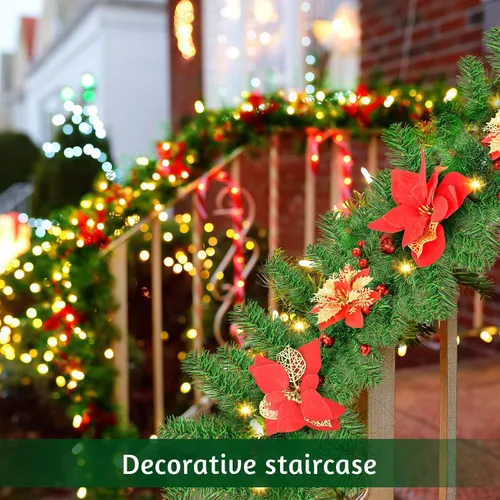 Vista 7 de Guirnalda de Navidad artificial preiluminada, ratán verde con decoraciones de flores rojas y luces LED que funcionan con pilas para escaleras