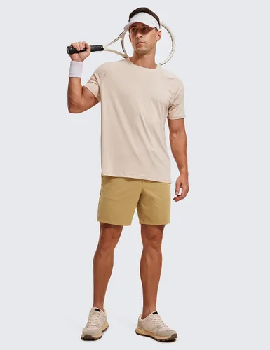 Vista 4 de CRZ YOGA Pantalones cortos de entrenamiento elásticos en cuatro direcciones para hombre, 7 pulgadas, suaves, duraderos, casuales, con bolsillos