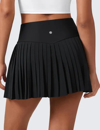 Vista 2 de CRZ YOGA Faldas de tenis plisadas de cintura alta para mujer con bolsillos, control de abdomen, forro casual, línea A, para entrenamiento y golf
