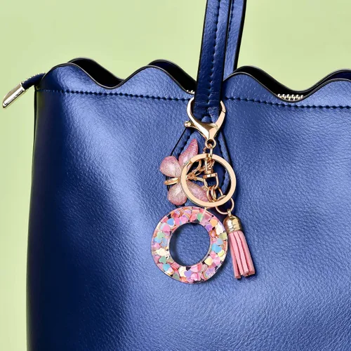 Vista 5 de Llavero de letra inicial del alfabeto de moda, borla y mariposa, llavero para bolso, bolsos de mano para mujeres y niñas