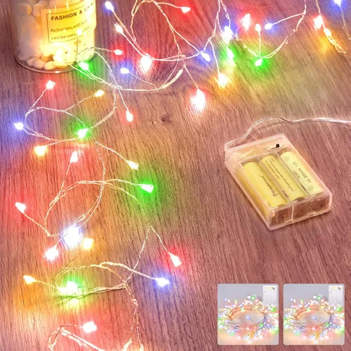 Vista 20 de Luces de hadas que funcionan con pilas, luces de cuerda centelleantes impermeables con cable plateado de 5 pies y 60 LED, luces de fuegos