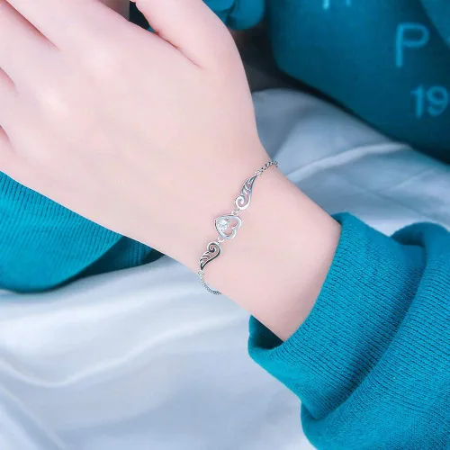 Vista 5 de Pulseras de plata de ley 925 con alas de ángel guardián para mujer, diseño de corazón de circonita ajustable, pulseras de cadena para joyería