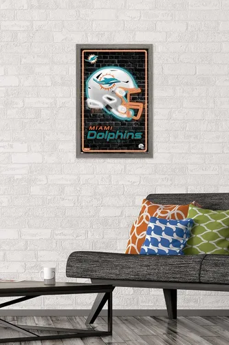 Vista 2 de Trends International NFL Miami Dolphins - Póster de pared con casco neón 23, 22.4 pulgadas de largo x 14.7 pulgadas, versión enmarcada en madera