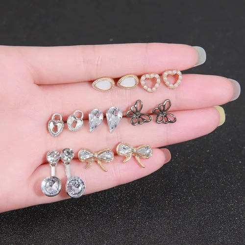 Vista 2 de Juego de 63 pares de aretes tipo dormilona para mujer, hipoalergénicos, variados, con bloqueo de luna, estrellas y perlas de imitación