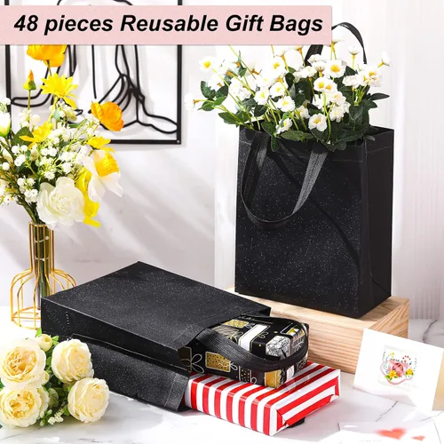 Vista 4 de Woanger Paquete de 48 bolsas de regalo con purpurina con asa, reutilizables, no tejidas, con purpurina para bodas, cumpleaños, despedidas de Negro