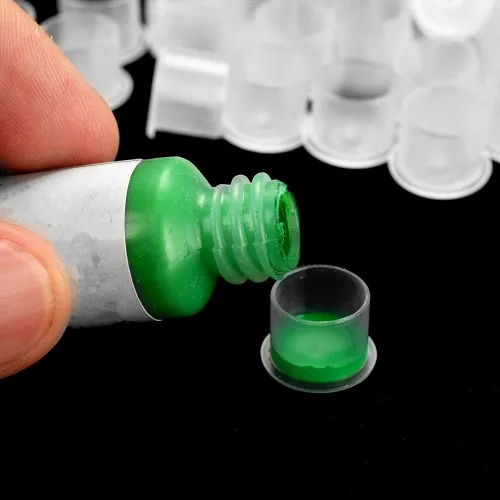 Vista 6 de Yuelong - 1000 tapas de tinta para tatuajes pequeñas, tapas de pigmento de plástico, vasos desechables para tatuajes con tamaños de base de 0.433 in
