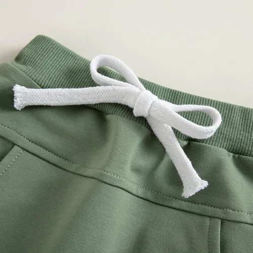 Vista 5 de Mubineo Pantalones deportivos básicos lisos para bebés, niños y niñas, cómodos pantalones de algodón con bolsillos