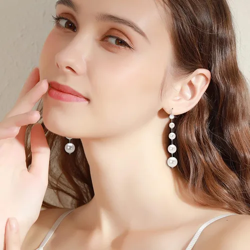 Vista 7 de Aretes largos de perlas para mujer, chapados en oro de 14 quilates, hipoalergénicos, elegantes aretes de borla de perlas doradas para niñas, Oro