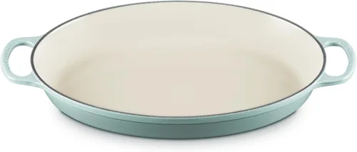 Vista 9 de Le Creuset - Cacerola ovalada de hierro fundido esmaltado Signature, 3 cuartos, modelo Caribbean