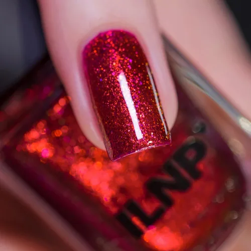 Vista 2 de ILNP Ruby - Esmalte de uñas rojo brillante con brillo vibrante