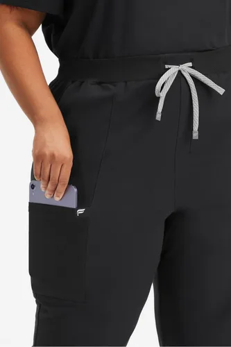Vista 4 de Fabletics MotionTech - Pantalón médico de rendimiento para mujer, elástico en 4 direcciones, con bolsillos, resistente a las arrugas, ajuste