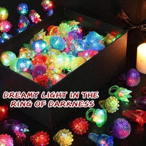 Vista 3 de Leyndo Paquete de 24 anillos con luz LED, recuerdos de fiesta, suministros de fiesta que brillan en la oscuridad, coloridos juguetes de goma
