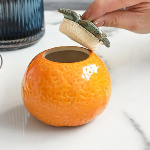 Vista 3 de DOITOOL Tarro de cerámica con forma de fruta naranja con tapa de 2.75 x 2.75 x 2.36 pulgadas, novedoso recipiente para hojas de té, almacenamiento