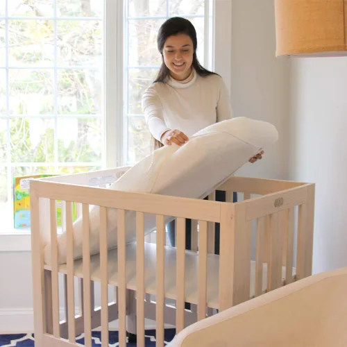 Vista 2 de Lullaby Earth Mini colchón para cuna de bebé, doble firmeza con protector extraíble lavable, transpirable para cuna de bebé, 38 x 24 pulgadas