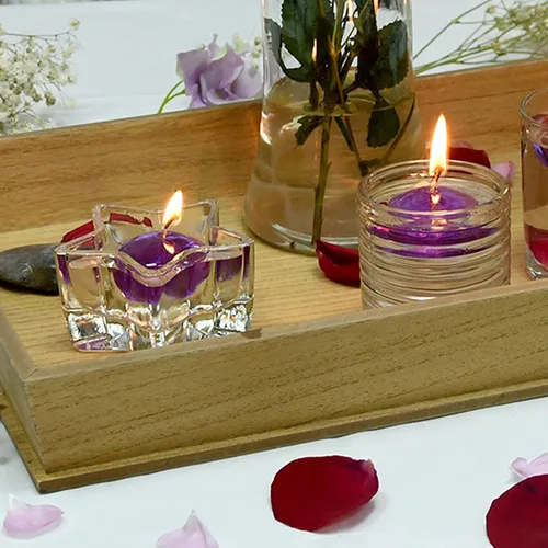 Vista 4 de Zest Candle Velas flotantes de 12 piezas, 1.75 pulgadas, gel morado transparente