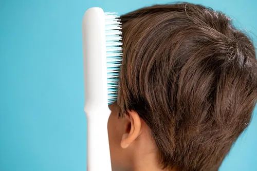 Vista 3 de Frida Baby Cepillo para desenredar el cabello fino o liso para niños Azul/Blanco
