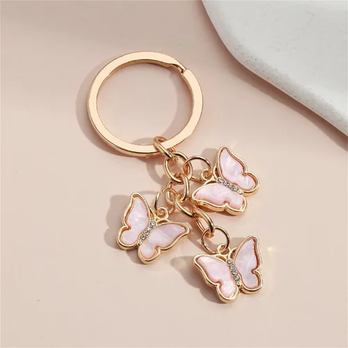 Vista 2 de Fuqimanman2020 Llavero con dije de mariposa con borla de cadena, bonito llavero de mariposa esmaltado para mujeres y niñas, decoración de bolso