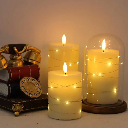 Vista 4 de Eldnacele Velas sin llama que funcionan con pilas con control remoto y temporizador, tira de luces LED de cera real, velas LED de pilar de cera