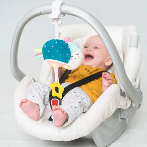 Vista 2 de Taf Toys Mini luna musical, juguete para bebés con música colgante y luces para llevar, compañero de viaje para padres y bebés, calma al bebé
