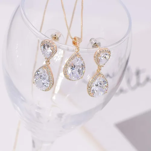 Vista 4 de Conjunto de joyería para boda, aretes de lagrima y collar con dije de circonio cúbico