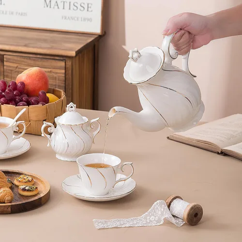 Vista 4 de Agyiuns Juego de té de 21 piezas de tazas de té y platillos de cerámica, juego de 6 con azúcar y crema y tetera, juego de tetera para adultos