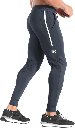 Vista 3 de BROKIG Pantalones deportivos ligeros de gimnasio para hombre, pantalones deportivos de entrenamiento con bolsillo con cremallera, pantalones