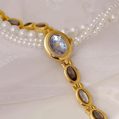 Vista 4 de CARLIEN Reloj de pulsera de cuarzo ovalado para mujer, de lujo, delicado, dorado, plateado, perla y números arábigos, fácil de leer, resistente al