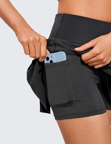 Vista 5 de CRZ YOGA Faldas plisadas de tenis para mujer con bolsillos de 13 pulgadas, faldas de golf de cintura alta, faldas casuales de entrenamiento
