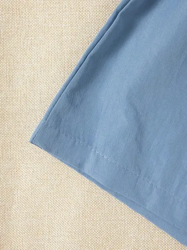 Vista 5 de OYOANGLE Conjunto de 2 piezas para niña con diseño gráfico de malla, manga de mariposa, ribete de volantes, camiseta y pantalones cortos con lazo
