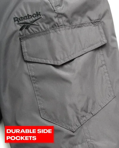 Vista 5 de Reebok Pantalones de nieve para niños Pantalones de snowboard pesados impermeables con bolsillos tipo cargo, polainas de nieve Pantalones de esquí